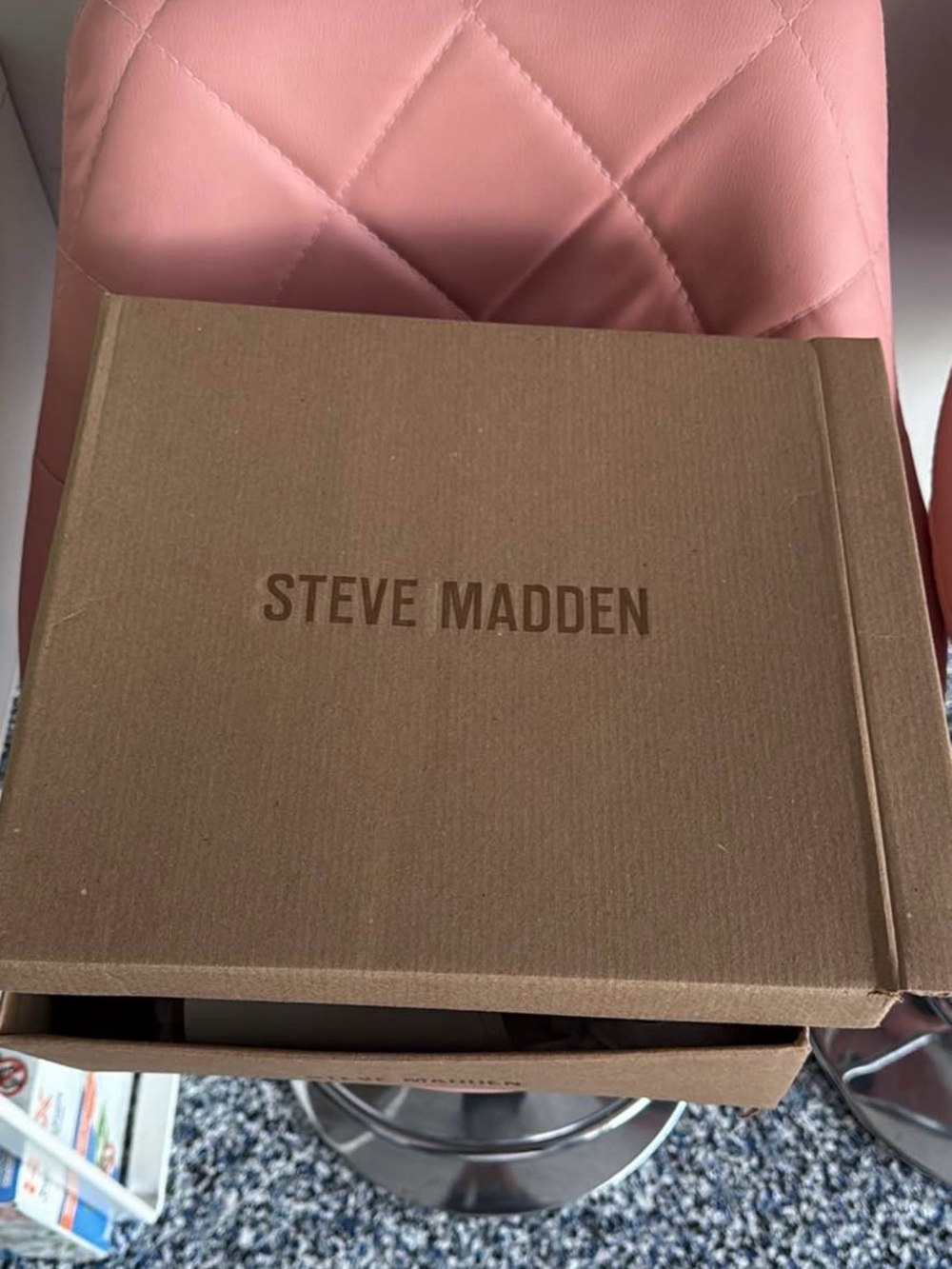 Steve Madden Brown Shoe Box on Pink Chair